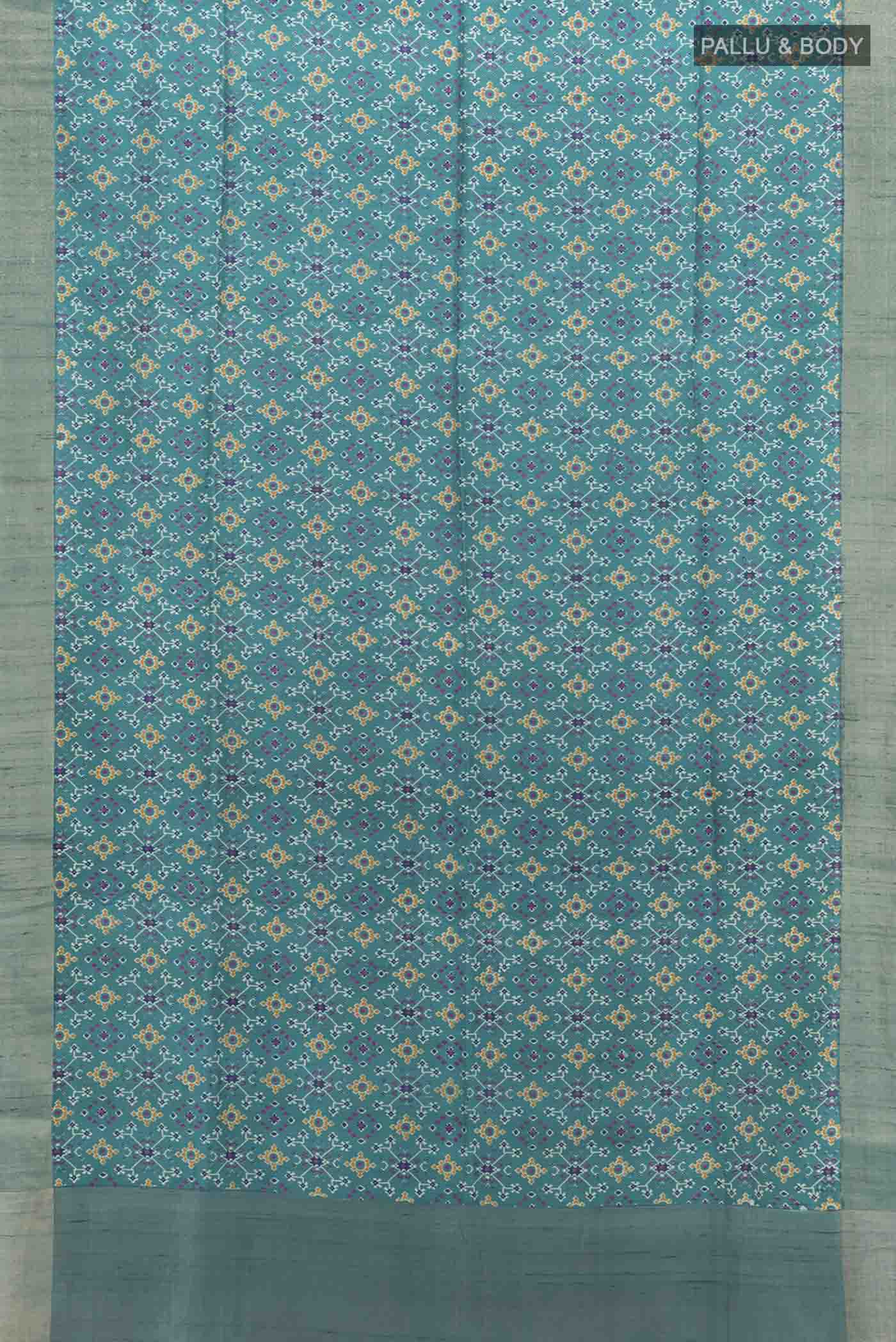 Flat view of Blue Tussar Silk Saree with Ikat Print on the body and Zari Border