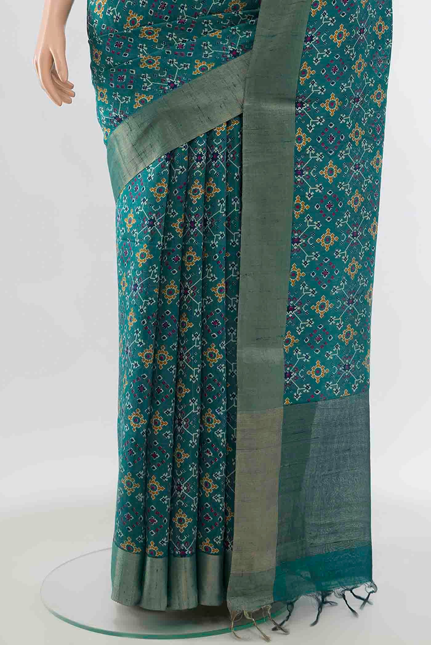 Pleats and pallu of Blue Tussar Silk Saree with Ikat Print on the body and Zari Border