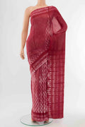 Rust Maheshwari Silk Cotton Saree with Thread Butta on the body and Thread Border displayed on a mannequin