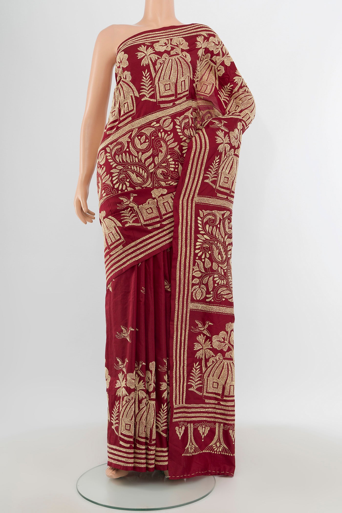 Maroon Kantha Silk Saree with Kantha Work on the body and Embroidery Border.  displayed on a mannequin