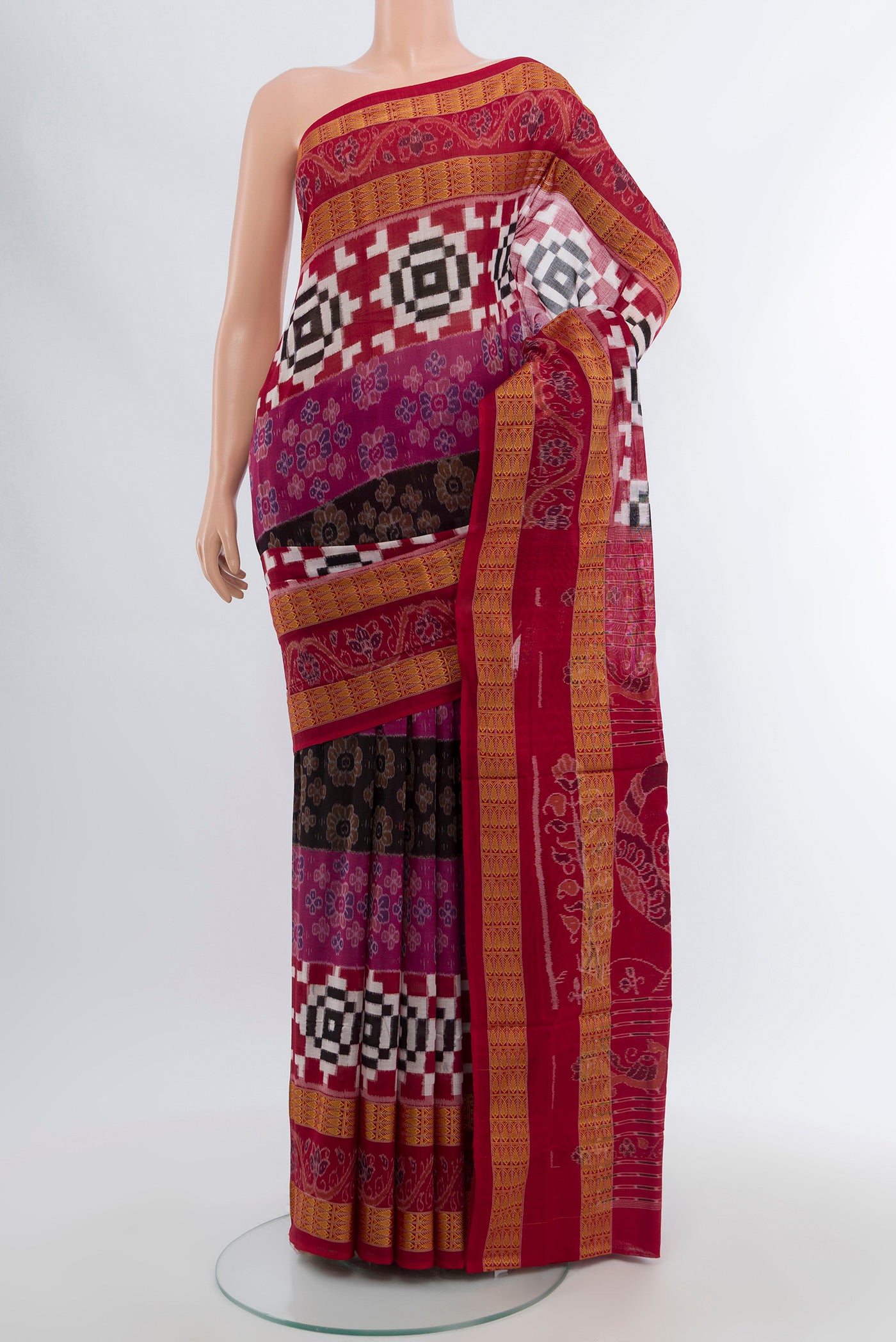 Multi Color Orissa Silk Saree with Ikat Print on the body and Silk Border.  displayed on a mannequin