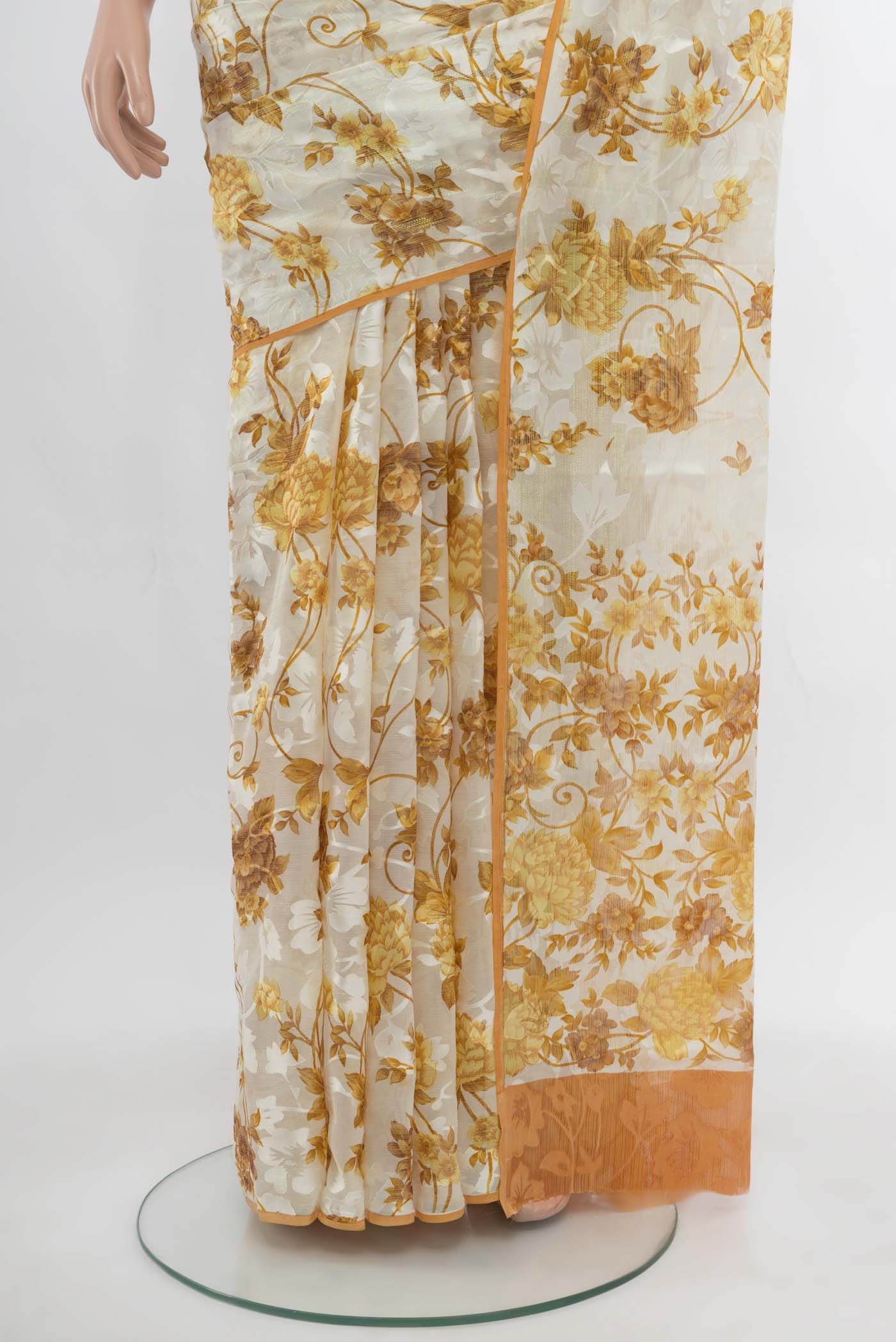 Pleats and pallu of Off White Chiffon Saree with Zari Butta on the body and Silk Border. 