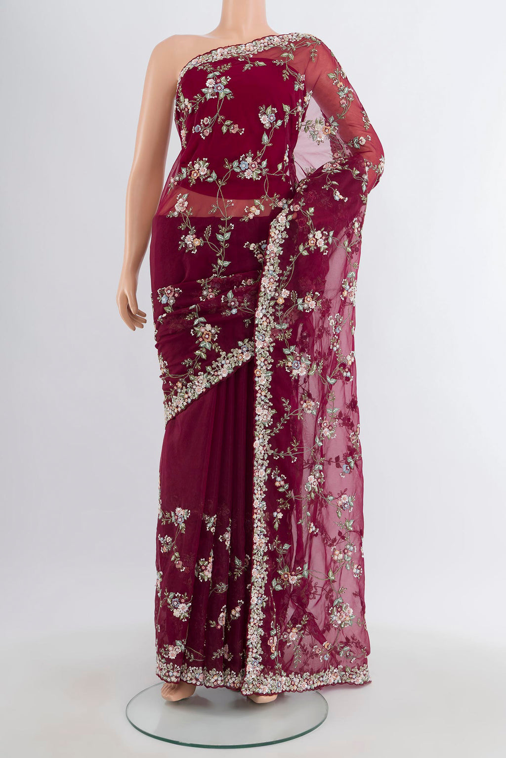 Maroon Embroidery Net Saree with Embroidery on the body and Embroidery Border.  displayed on a mannequin