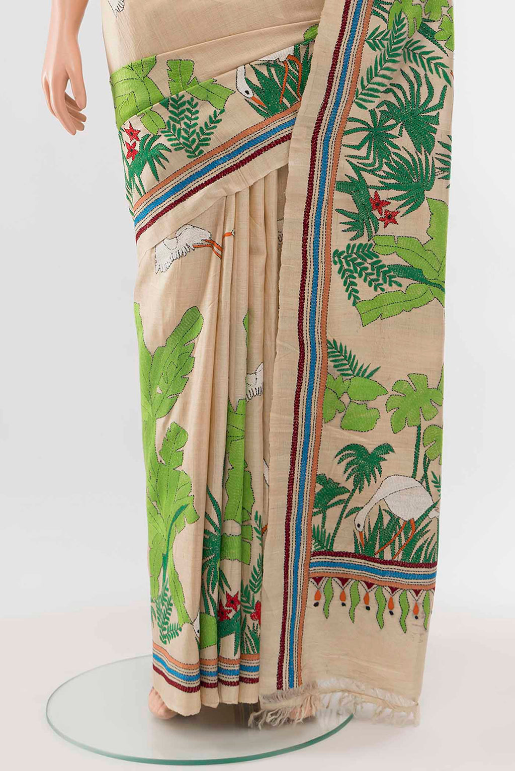 Pleats and pallu of Cream Tussar Silk Saree with Embroidery on the body and Silk Border