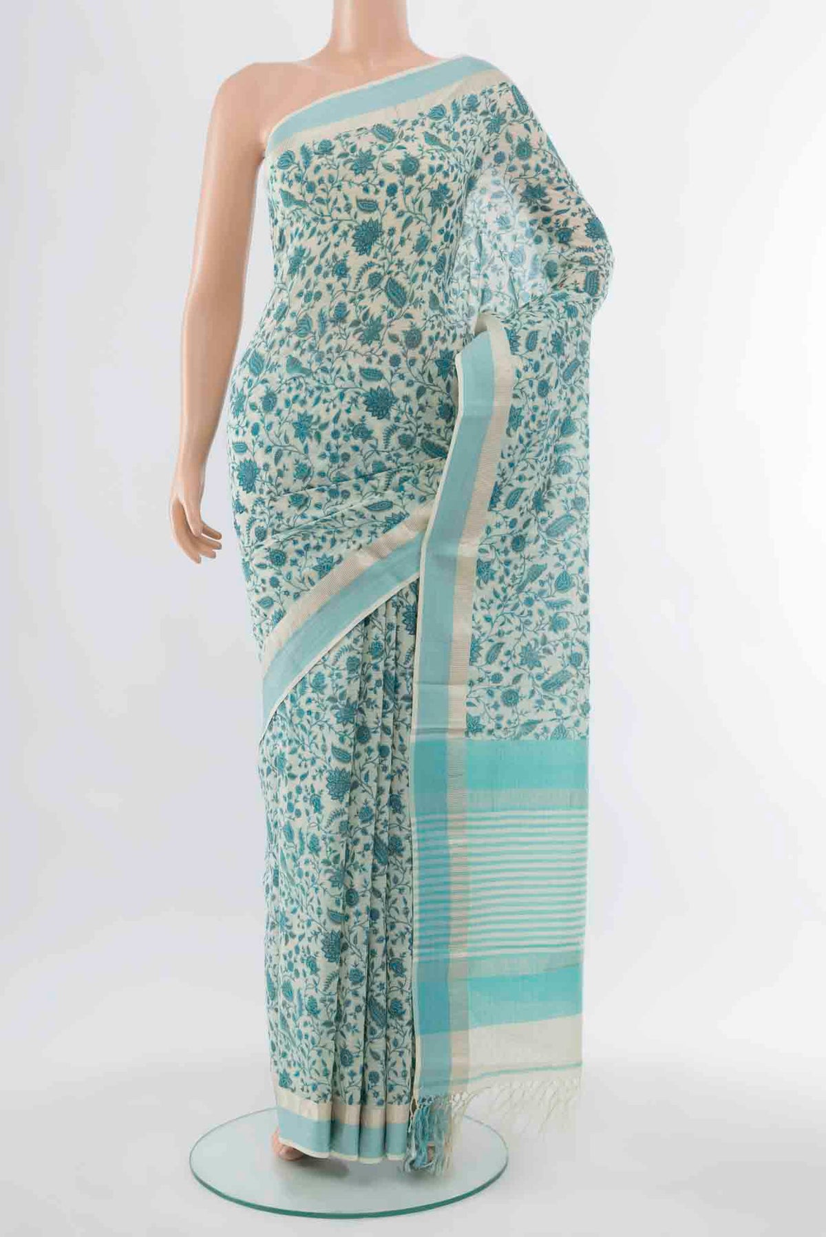 Sky Blue Maheshwari Silk Cotton Saree with Floral Print on the body and Silk Border displayed on a mannequin