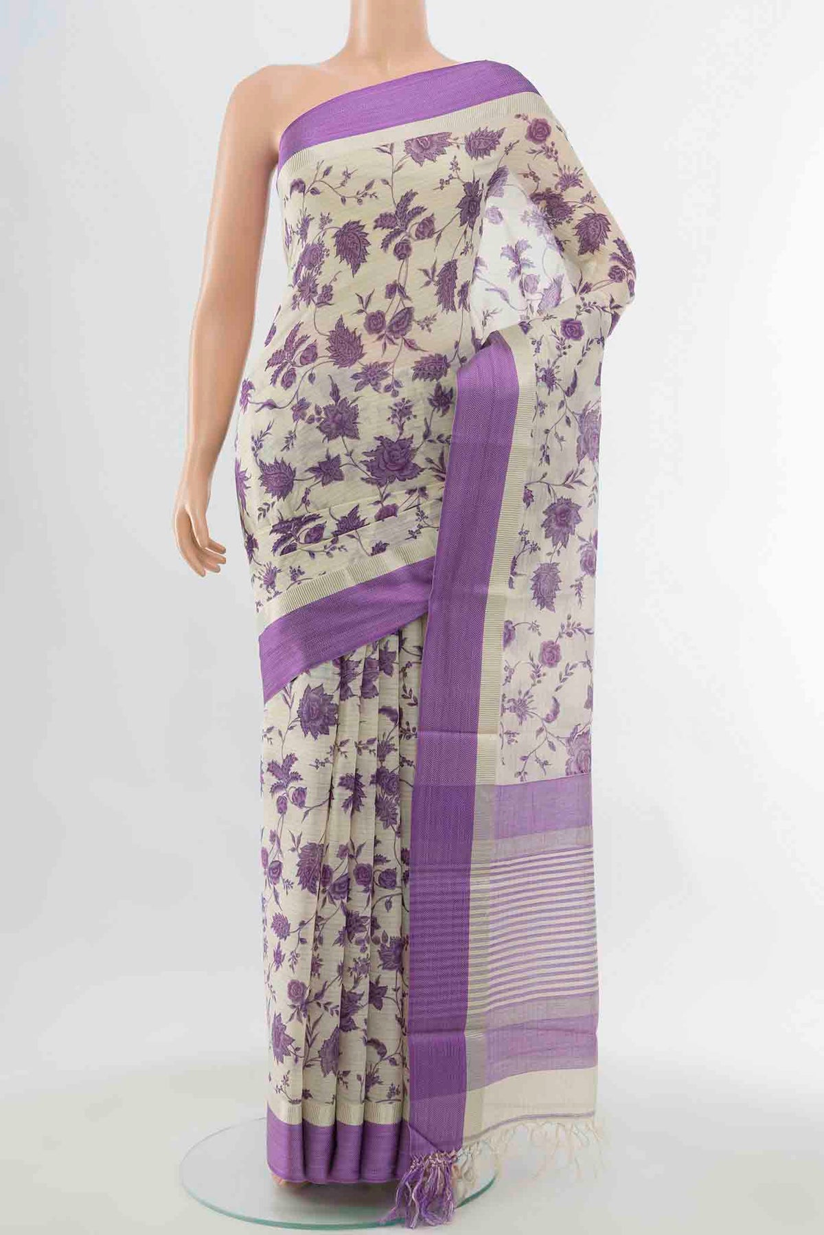 Cream Maheshwari Silk Cotton Saree with Floral Print on the body and Silk Border displayed on a mannequin