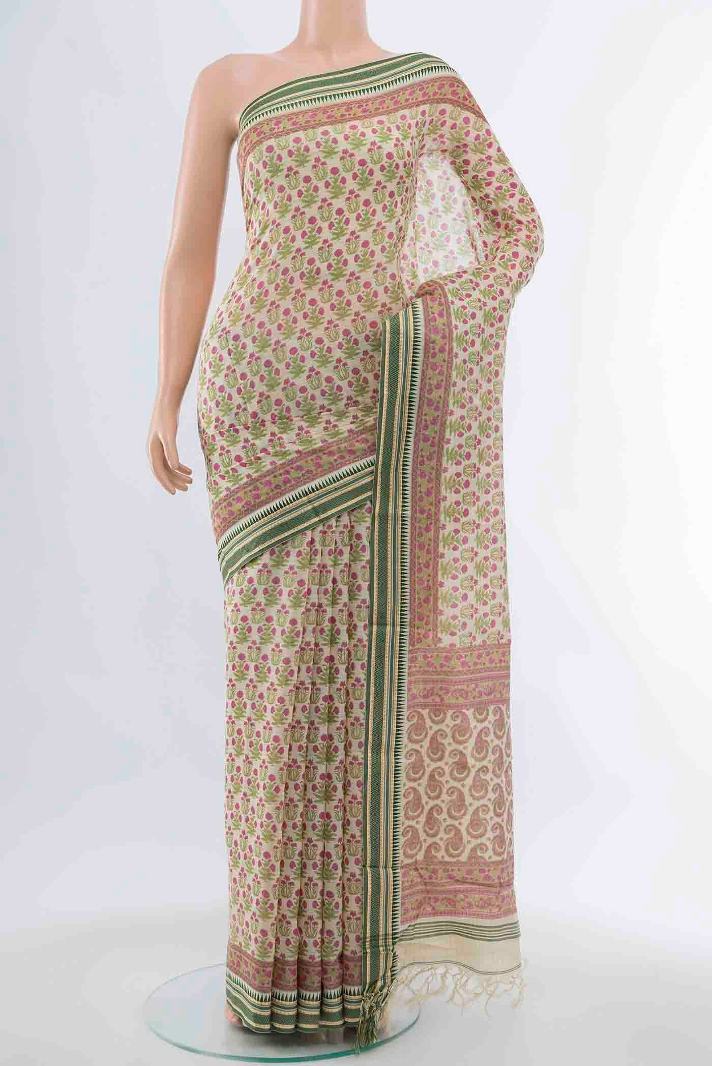 Light Green Tussar Silk Saree with Floral Print on the body and Silk Border displayed on a mannequin