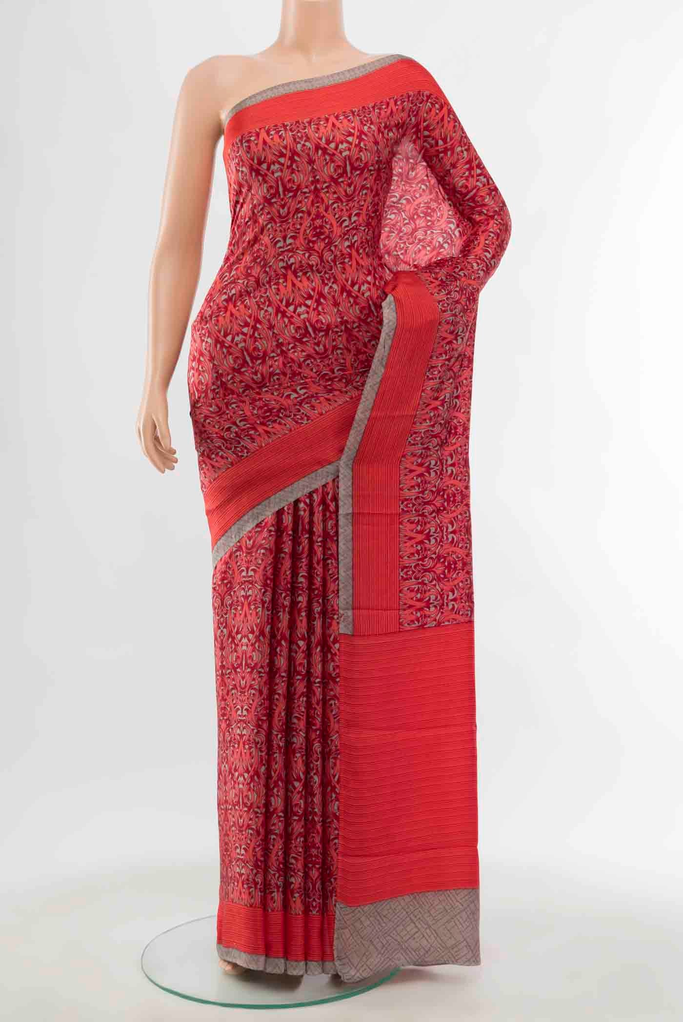 Red Printed Silk Saree with Floral Print on the body and Silk Border displayed on a mannequin