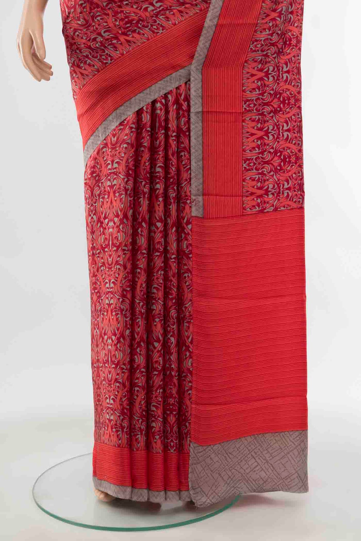 Pleats and pallu of Red Printed Silk Saree with Floral Print on the body and Silk Border