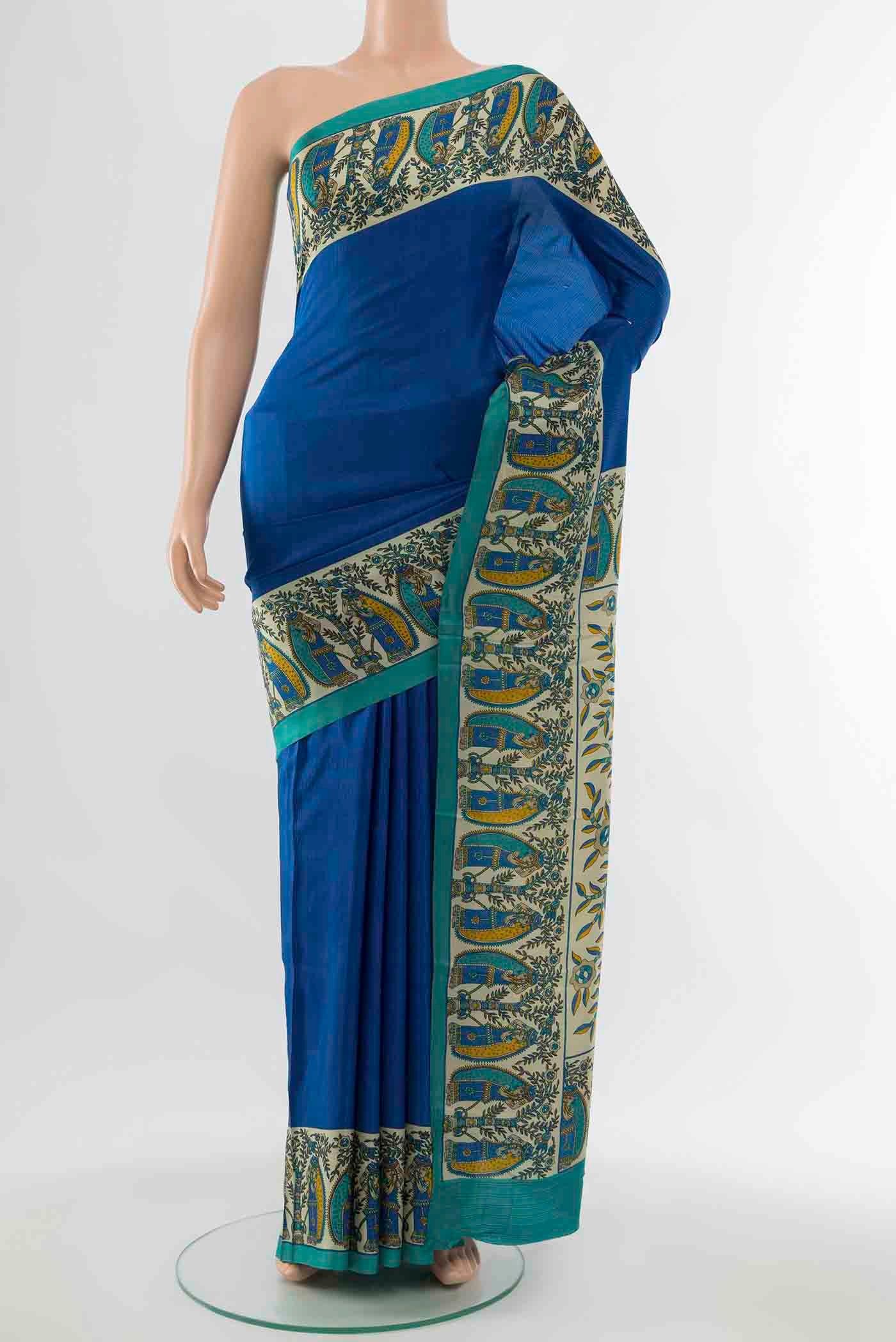 Blue Printed Silk Saree with Floral Print on the body and Silk Border displayed on a mannequin