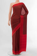 Black Printed Silk Saree with Floral Print on the body and Attached Border displayed on a mannequin
