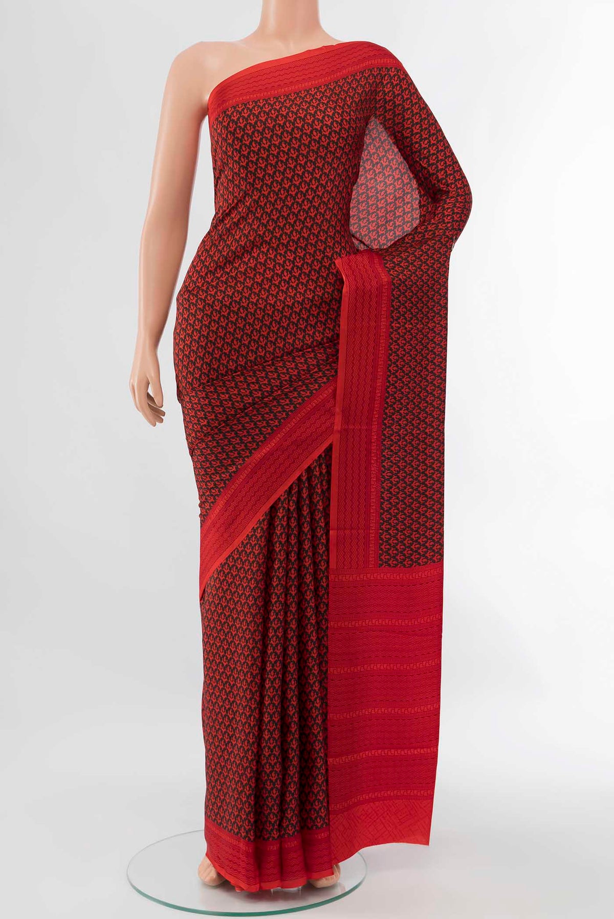 Black Printed Silk Saree with Floral Print on the body and Attached Border displayed on a mannequin