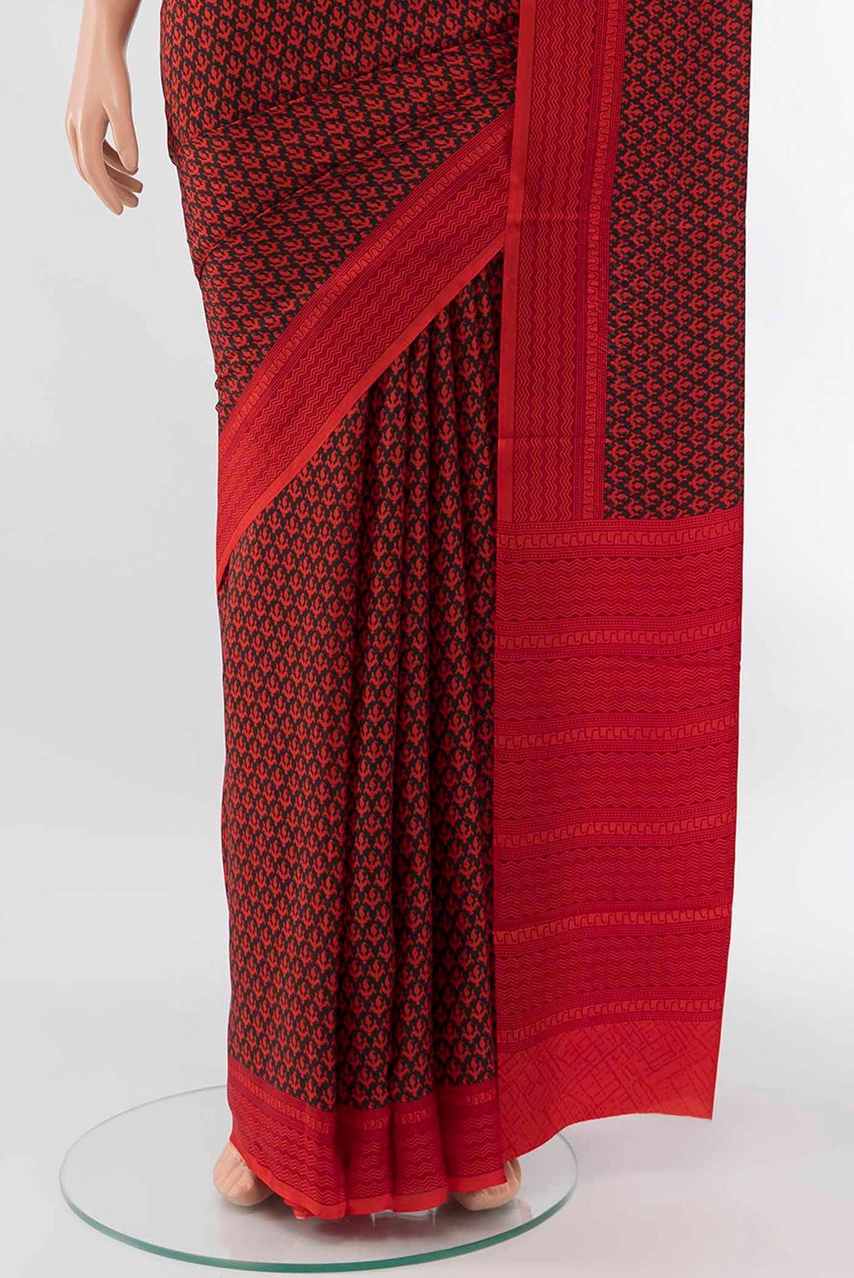 Pleats and pallu of Black Printed Silk Saree with Floral Print on the body and Attached Border