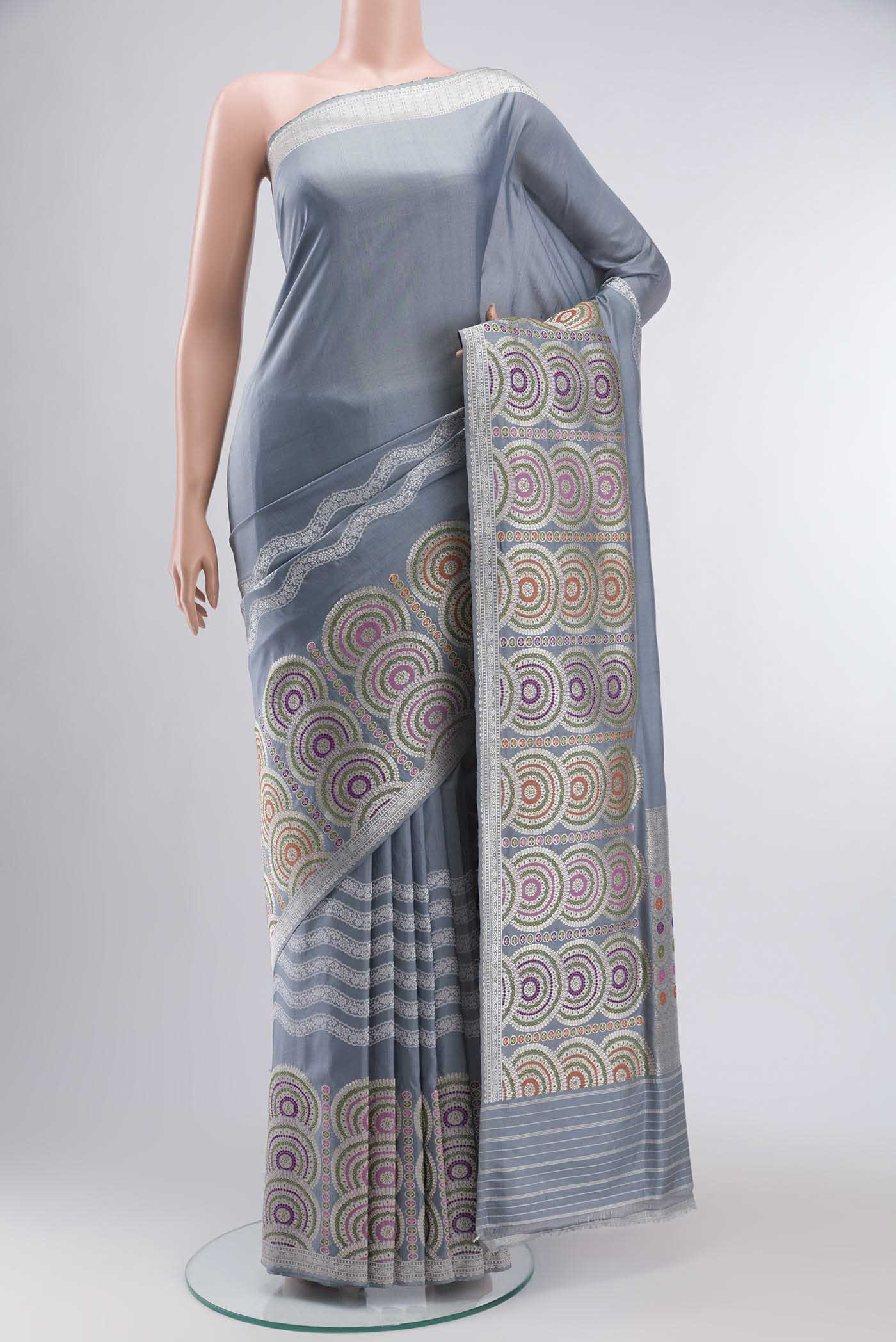 Grey Banarasi Silk Saree with Plain Body and Zari Border displayed on a mannequin
