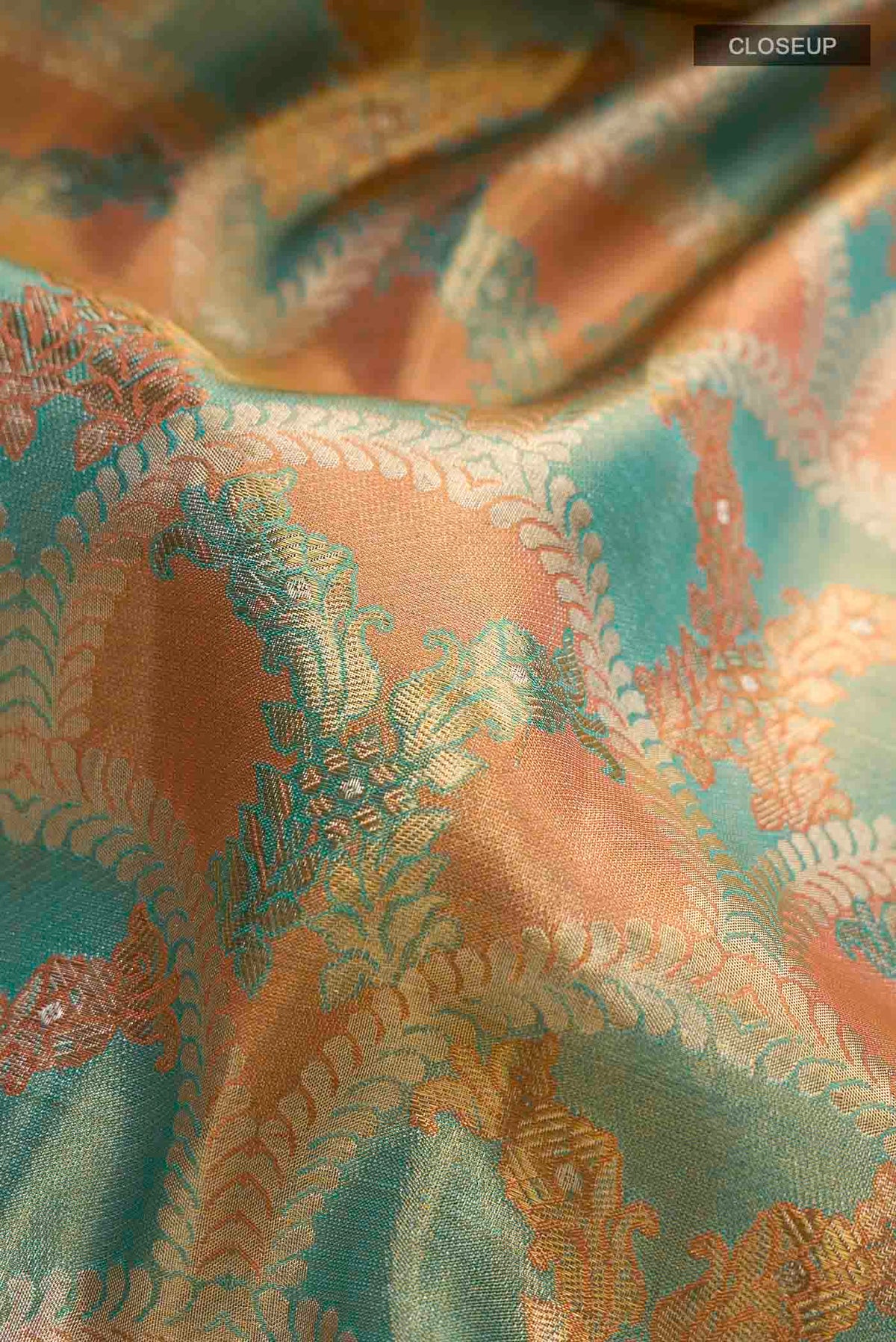 Close up of Pure Silk Pure Zari Multi Kanchipuram Tissue Saree with Zari Brocade on the body and Zari Border displaying folds