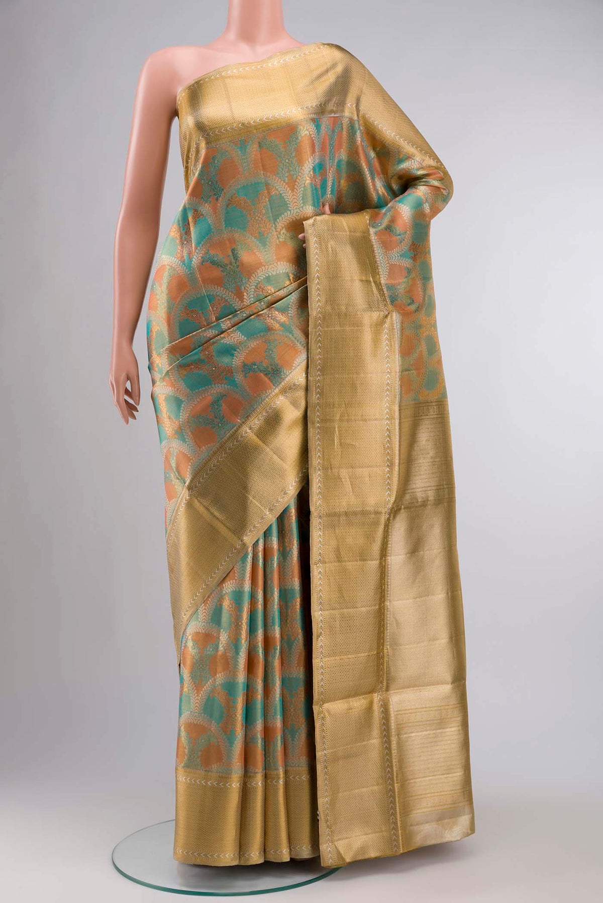 Pure Silk Pure Zari Multi Kanchipuram Tissue Saree with Zari Brocade on the body and Zari Border displayed on a mannequin