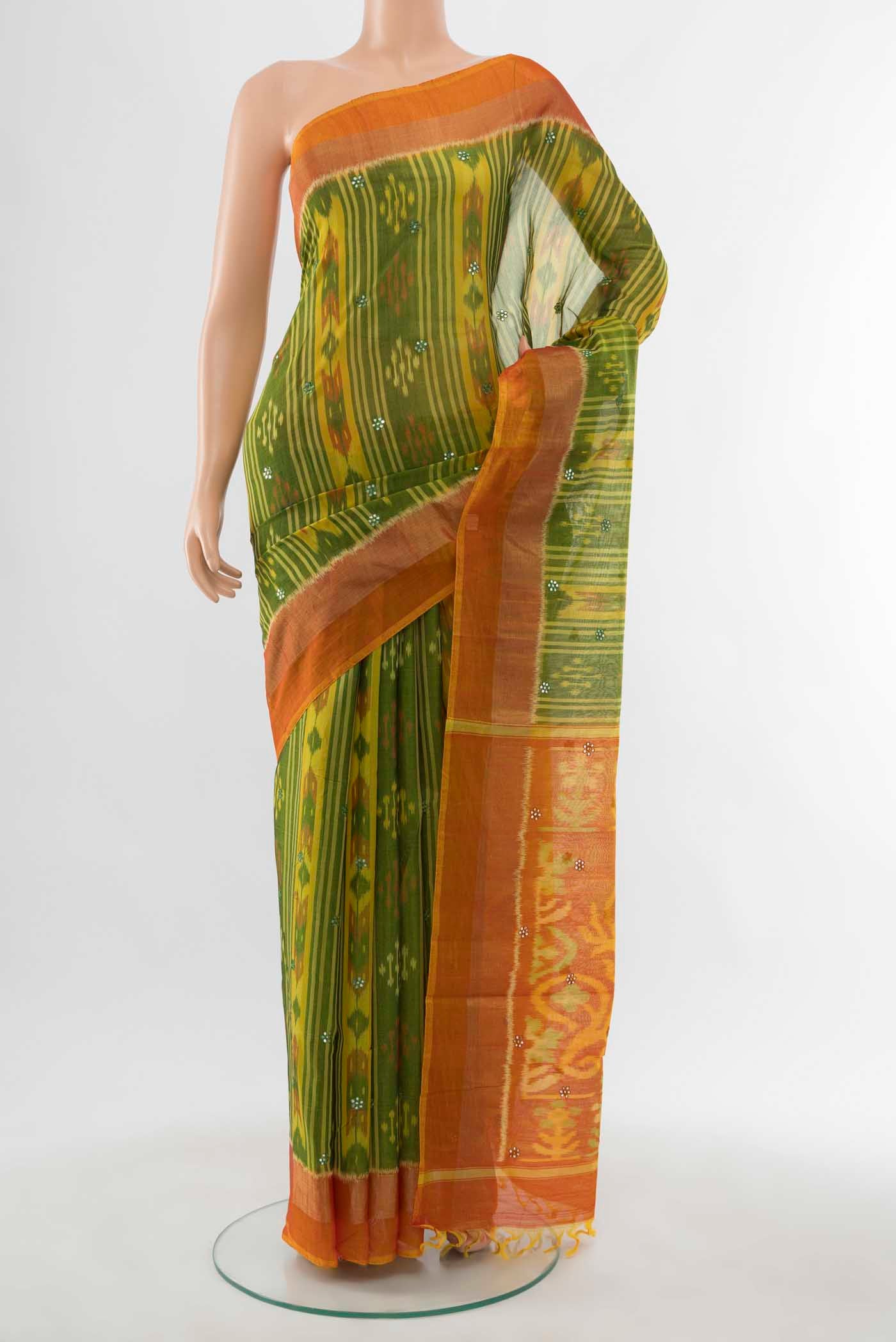 Parrot Green Pochampally Cotton Saree with Ikat Print on the body and Plain Border displayed on a mannequin