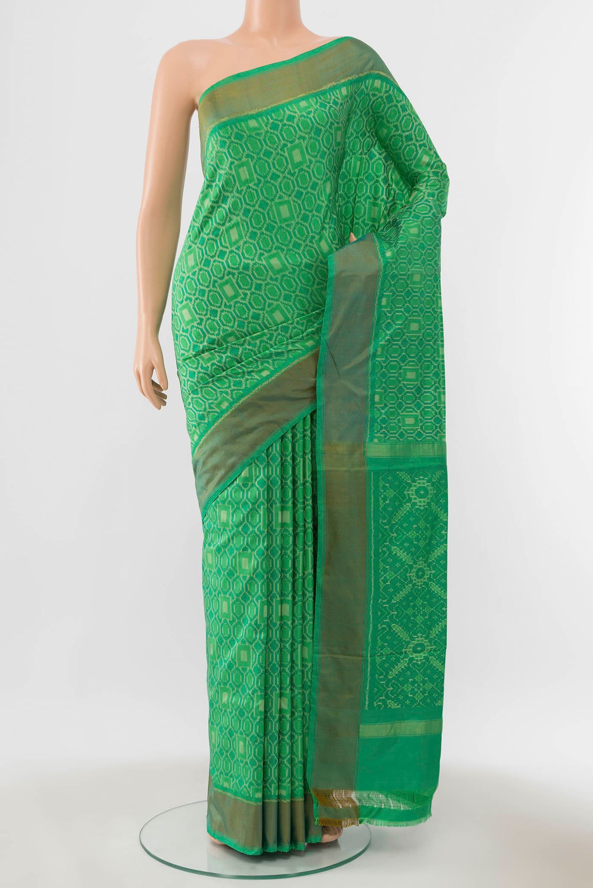 Green Pochampally Silk Saree with Ikat Print on the body and Zari Border displayed on a mannequin