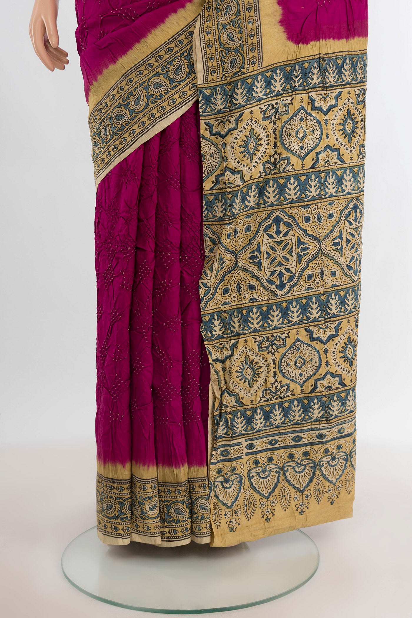 Pleats and pallu of Magenta Bandhani Silk Saree with Bandhani on the body and Printed Border. 