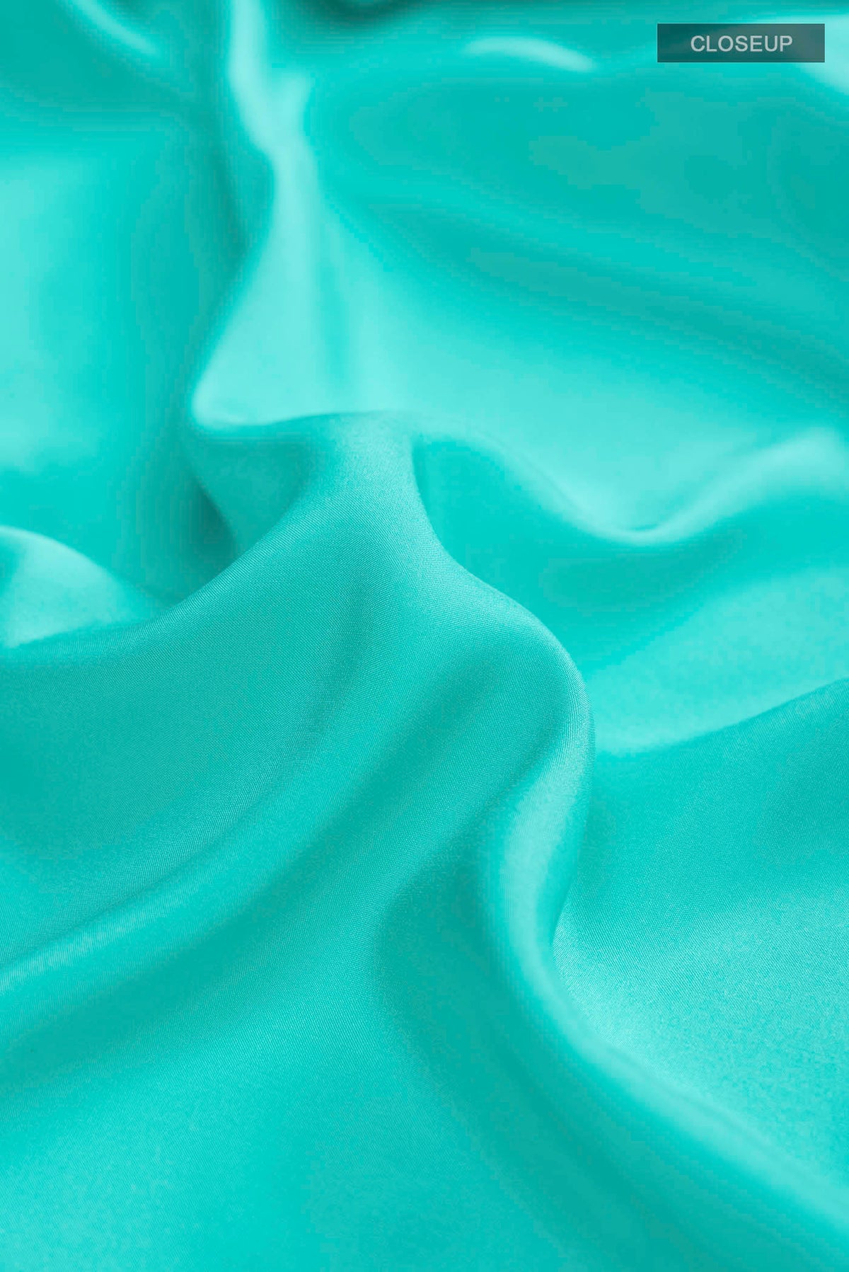 Close up of Blue Mysore Crepe Saree with Plain Body and Zari Border displaying folds