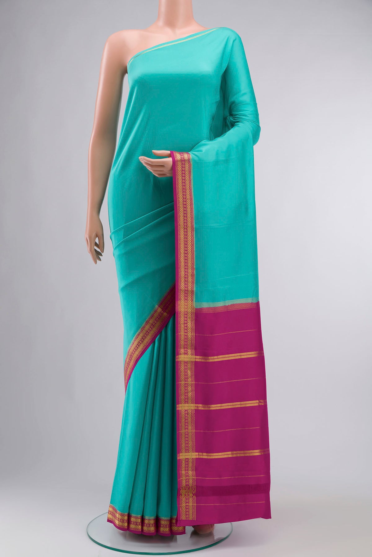 Blue Mysore Crepe Saree with Plain Body and Zari Border displayed on a mannequin