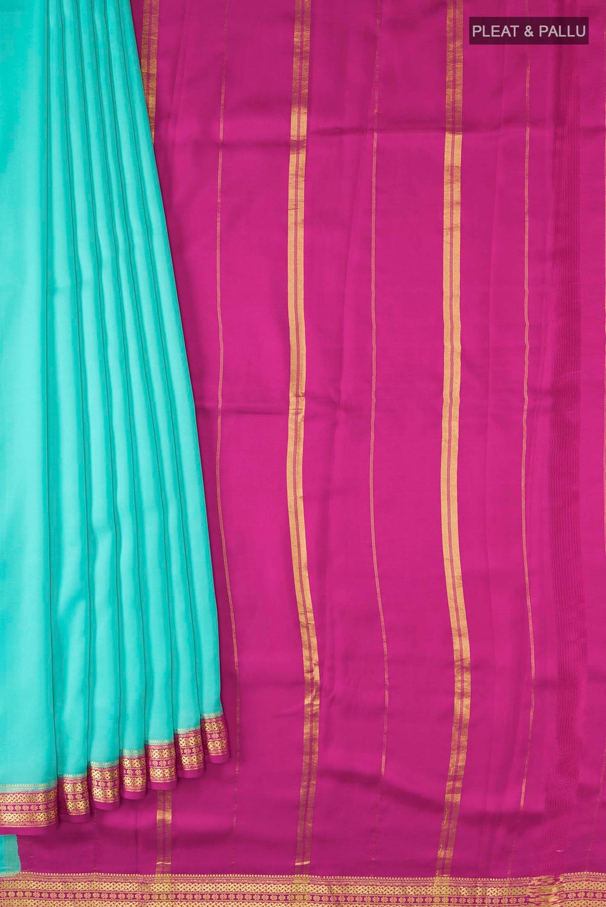 Pleats and pallu of Blue Mysore Crepe Saree with Plain Body and Zari Border
