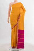 Yellow Mysore Crepe Saree with Plain Body and Silk Border.  displayed on a mannequin