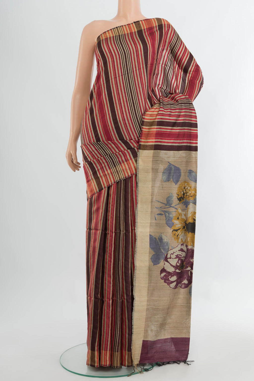 Multi Color Tussar Silk Saree with Floral Print on the body and Silk Border.  displayed on a mannequin