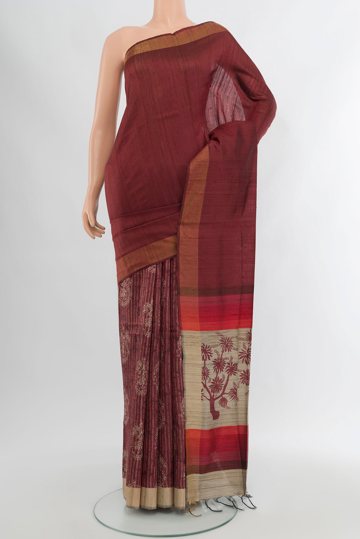 Brown Tussar Silk Saree with Half And Half on the body and Zari Border.  displayed on a mannequin