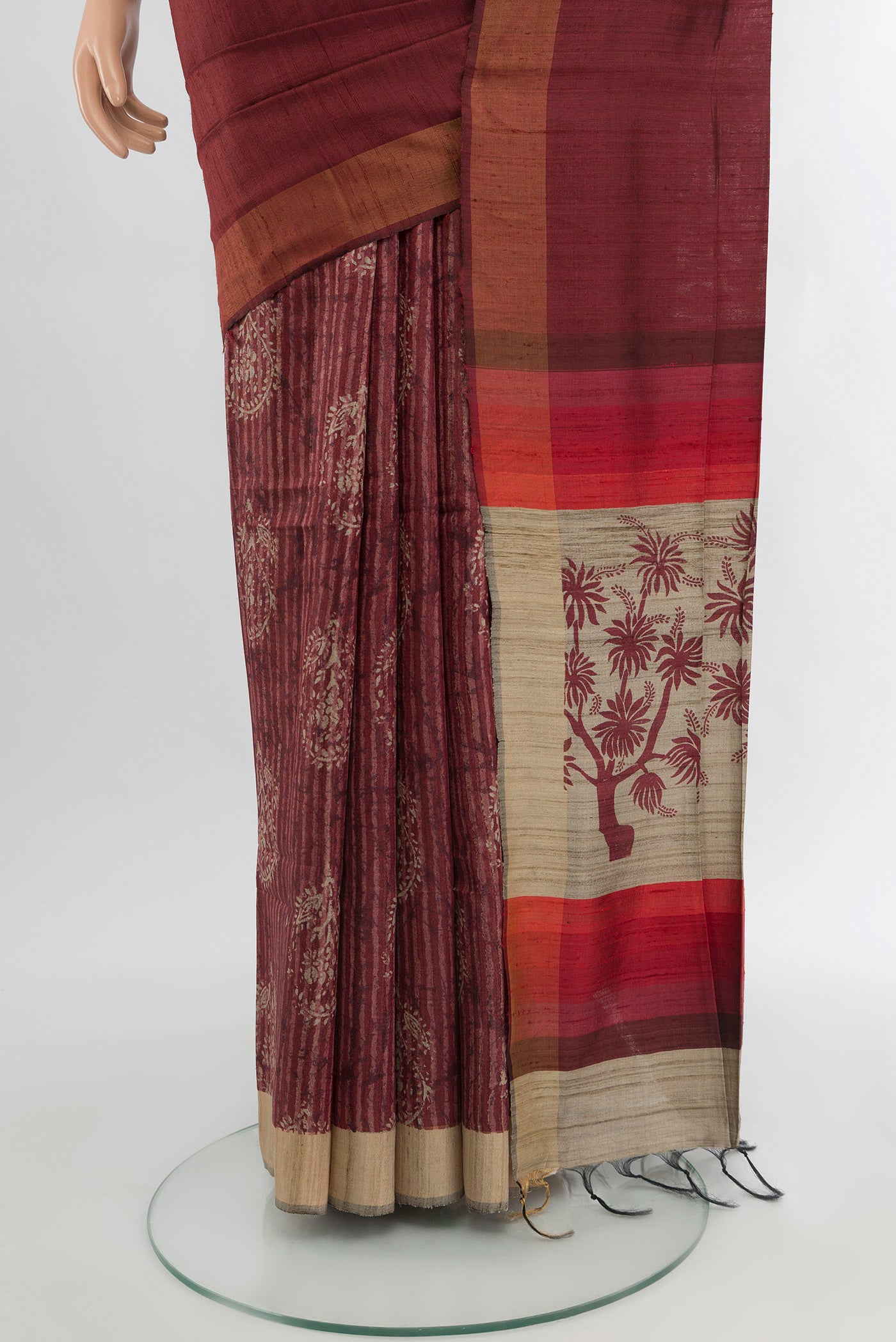 Pleats and pallu of Brown Tussar Silk Saree with Half And Half on the body and Zari Border. 
