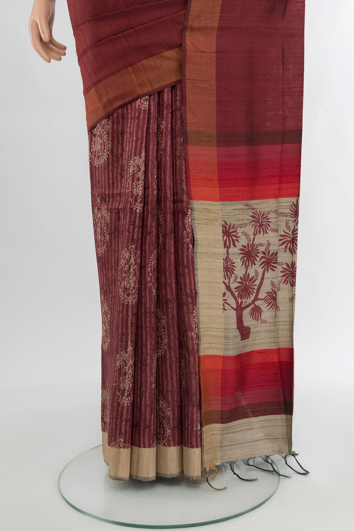 Pleats and pallu of Brown Tussar Silk Saree with Half And Half on the body and Zari Border. 