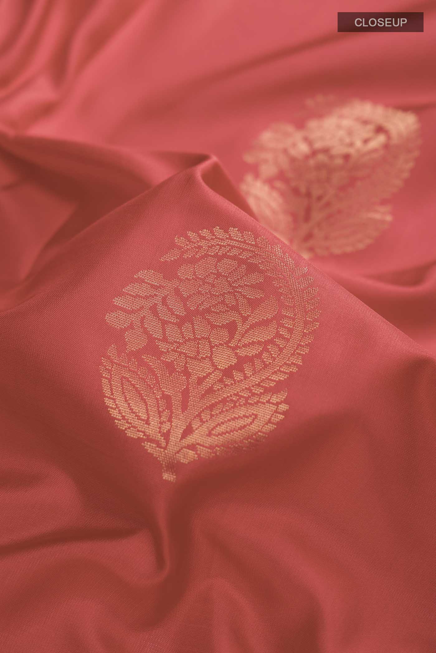 Close up of Red Soft Silk Saree with Zari Butta on the body and Zari Border displaying folds