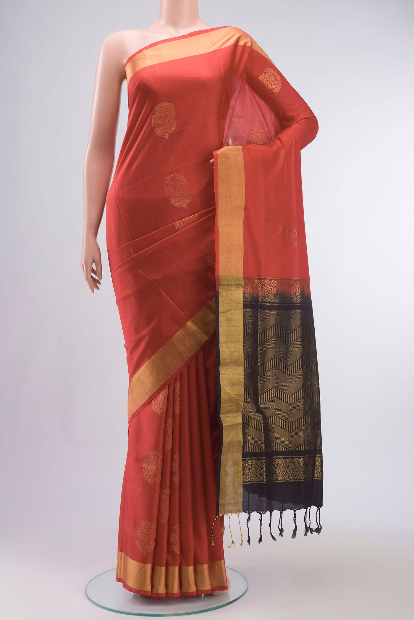 Red Soft Silk Saree with Zari Butta on the body and Zari Border displayed on a mannequin