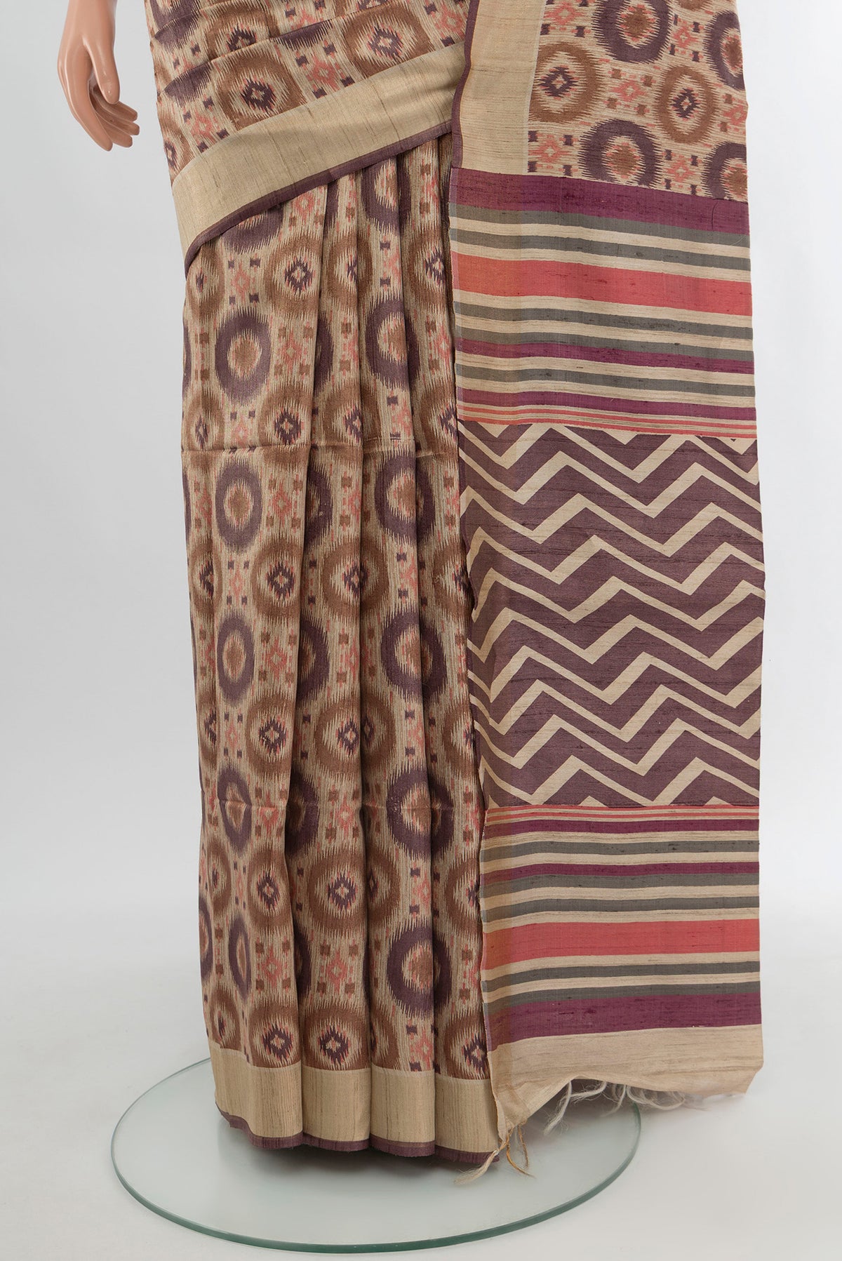 Pleats and pallu of Beige Tussar Silk Saree with Floral Print on the body and Zari Border. 
