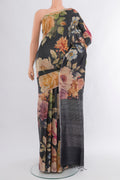 Black Tussar Silk Saree with Floral Print on the body and Zari Border.  displayed on a mannequin