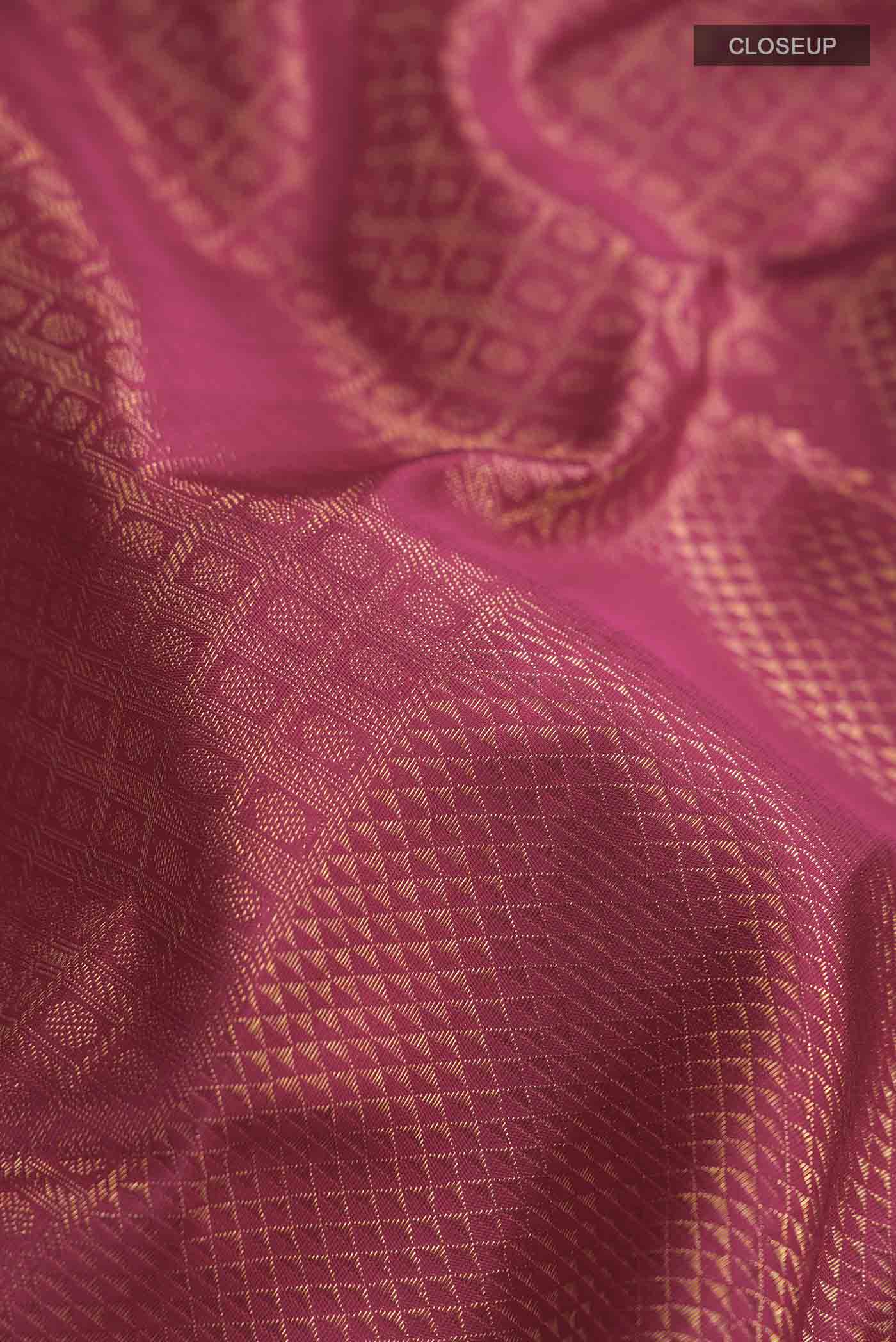 Close up of Pure Silk Pure Zari Maroon Kanchipuram Saree with Zari Brocade on the body and Zari Border displaying folds