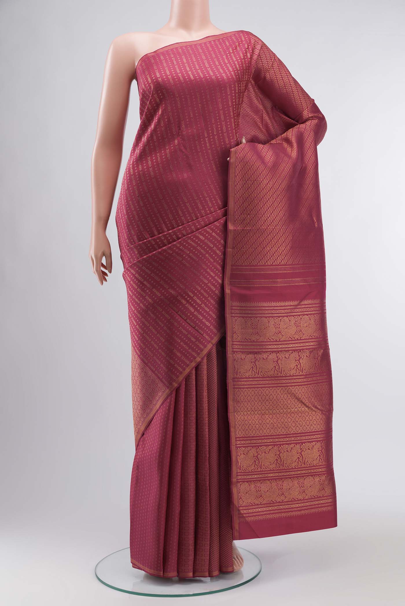 Pure Silk Pure Zari Maroon Kanchipuram Saree with Zari Brocade on the body and Zari Border displayed on a mannequin