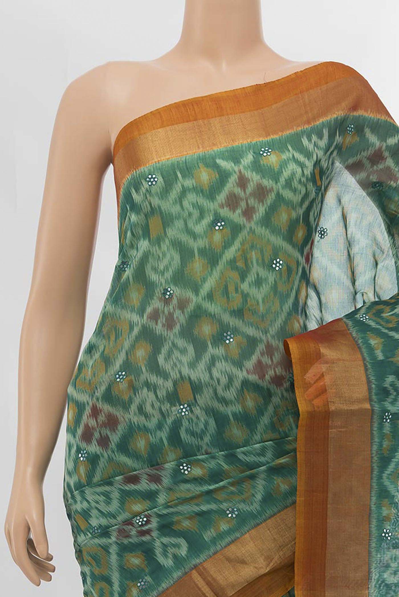 Border image of Green Silk Cotton Saree with Ikat design on the body and Zari Border
