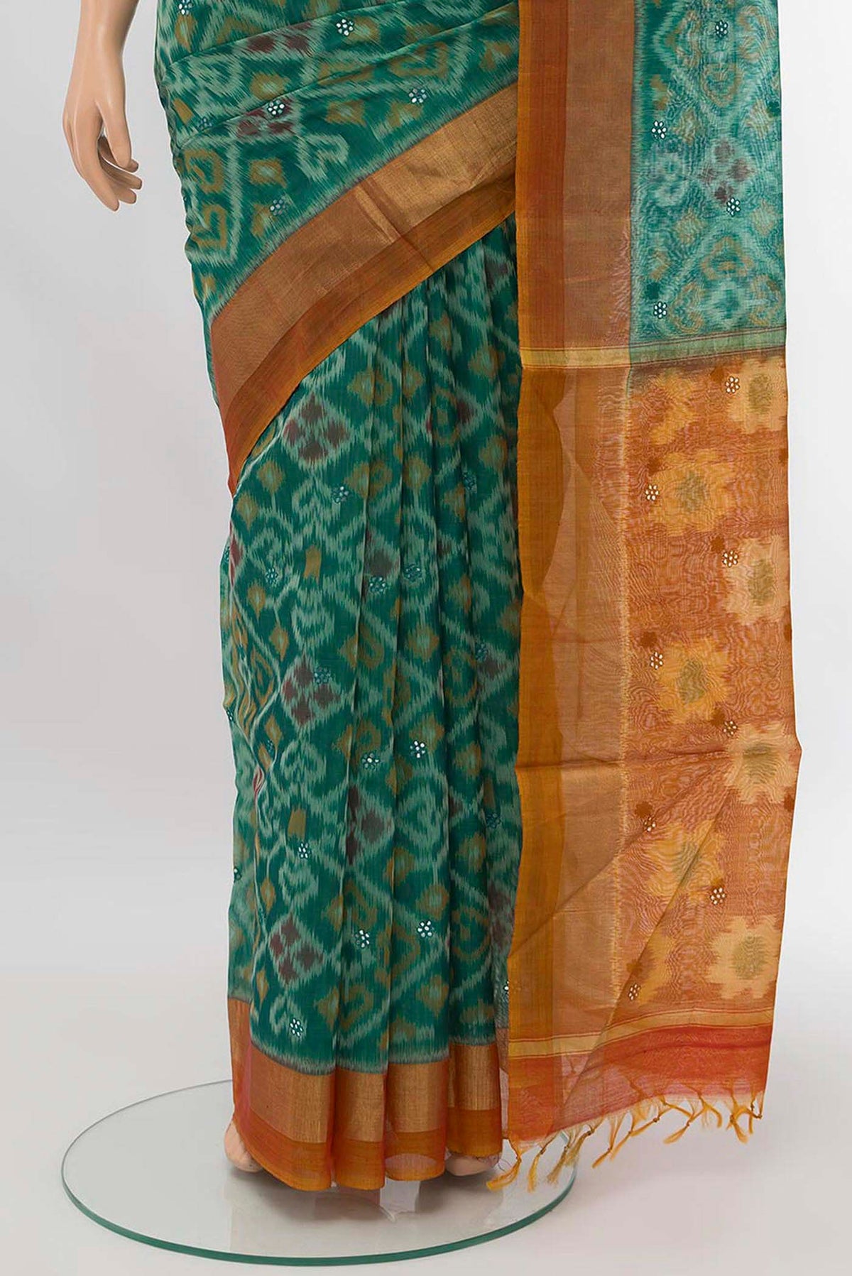 Pleats and pallu of Green Silk Cotton Saree with Ikat design on the body and Zari Border