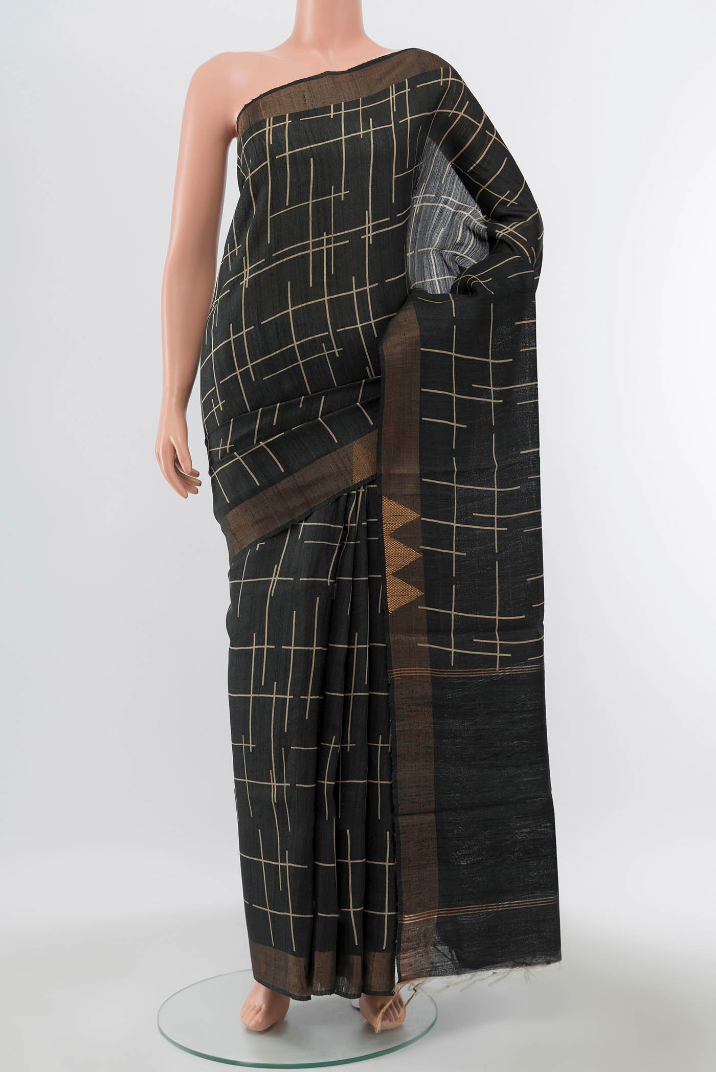 Grey Tussar Silk Saree with Printed design on the body and Zari Border displayed on a mannequin