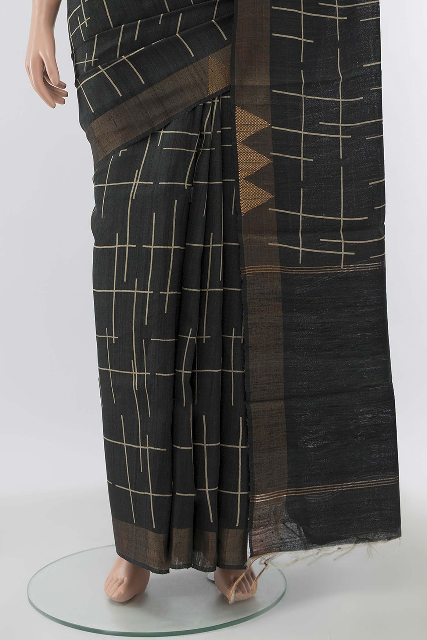 Pleats and pallu of Grey Tussar Silk Saree with Printed design on the body and Zari Border