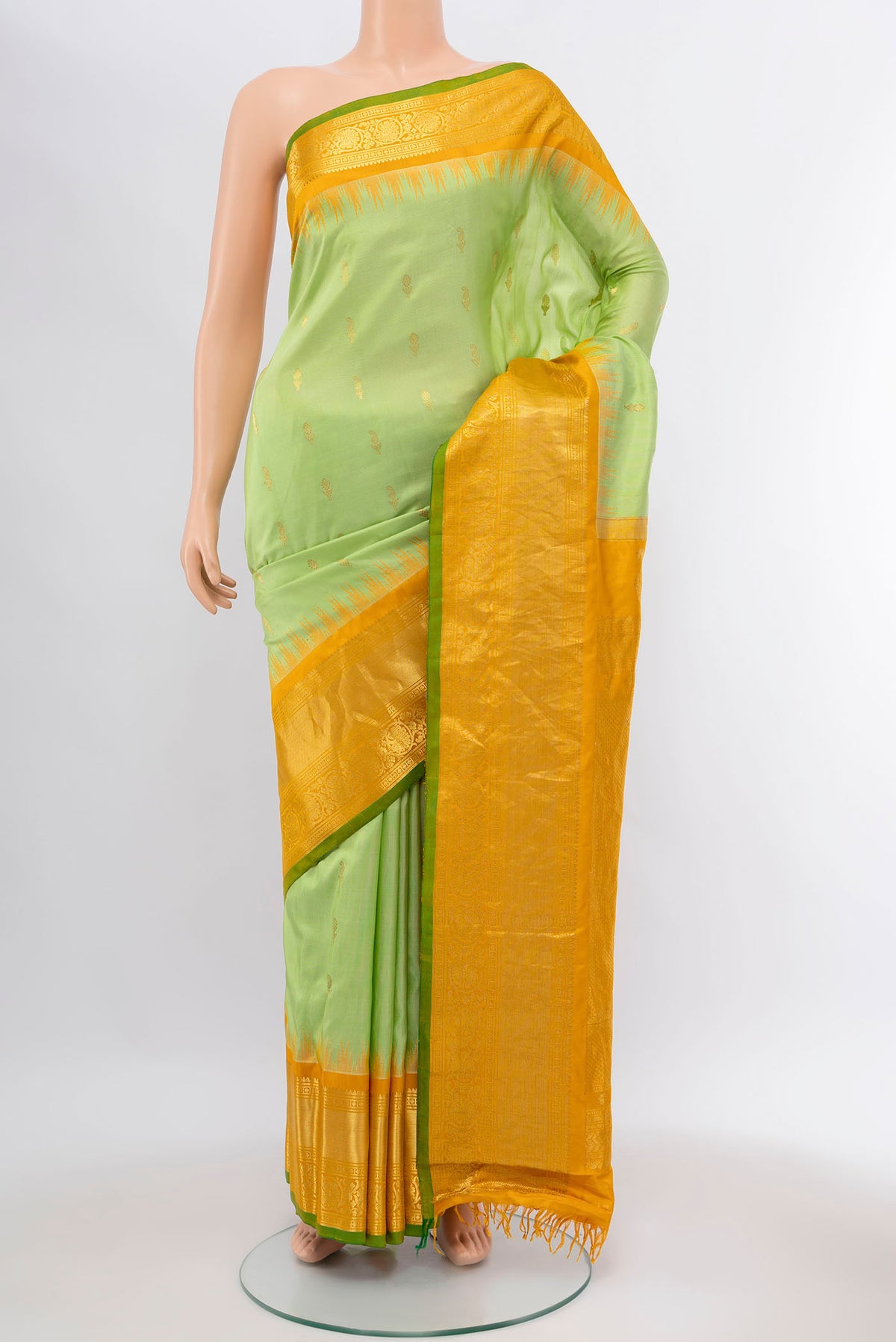 Pista Green Gadwal Silk Saree with Zari Brocade on the body and Silk Border displayed on a mannequin