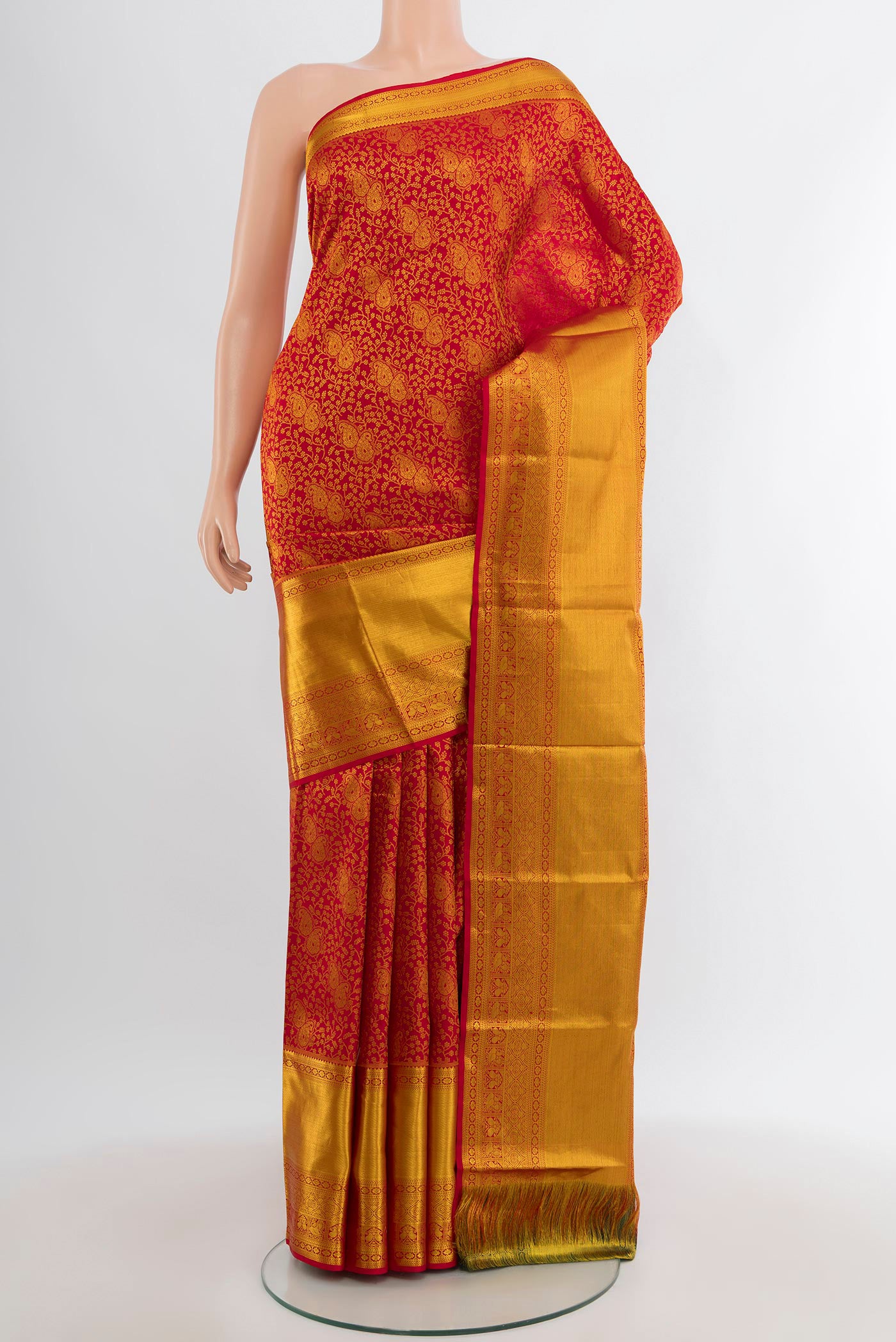 Red Kanjivaram Silk Saree with Zari Brocade on the body and Zari Border.  displayed on a mannequin
