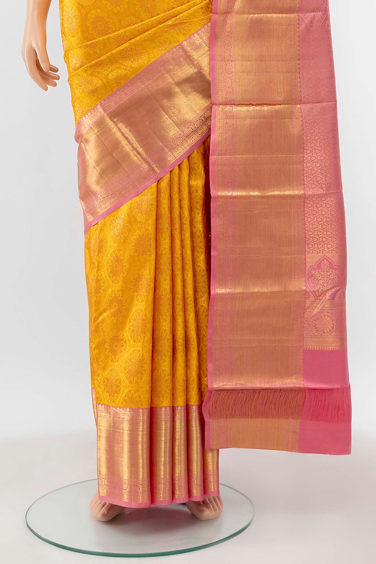 Pleats and pallu of Yellow Kanchipuram Silk Saree with Zari Brocade on the body and Zari Border