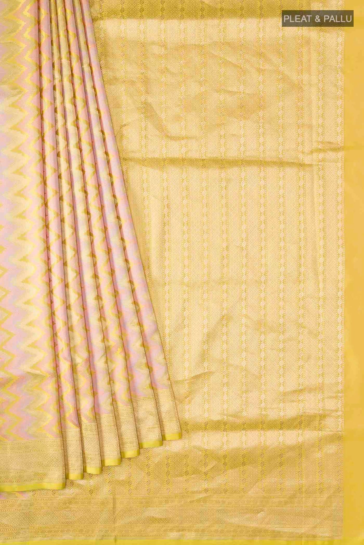Pleats and pallu of Yellow Banarasi Silk Saree with Zig Zag design on the body and Zari Border