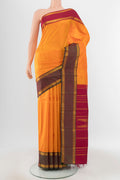 Pure Silk Pure Zari Yellow Kanchipuram Saree with Zari Butta on the body and Silk Border.  displayed on a mannequin
