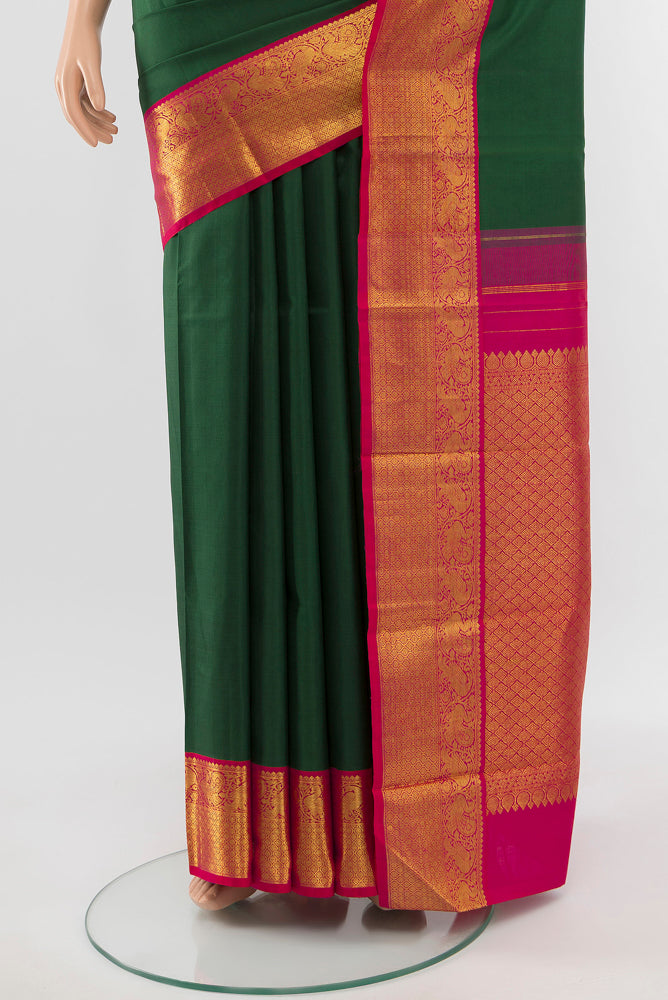 Pleats and pallu of Pure Silk Pure Zari Mint Green Kanjivaram Saree with Zari Butta on the body and Silk Border. 