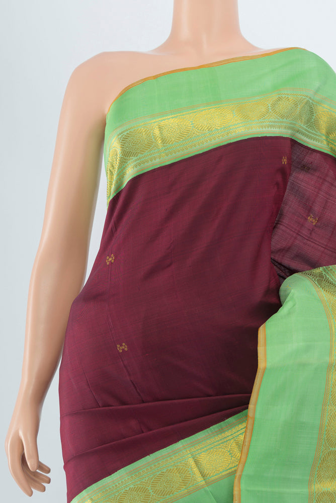 Border image of Maroon Kanjivaram Silk Saree with Zari Butta on the body and Silk Border. 