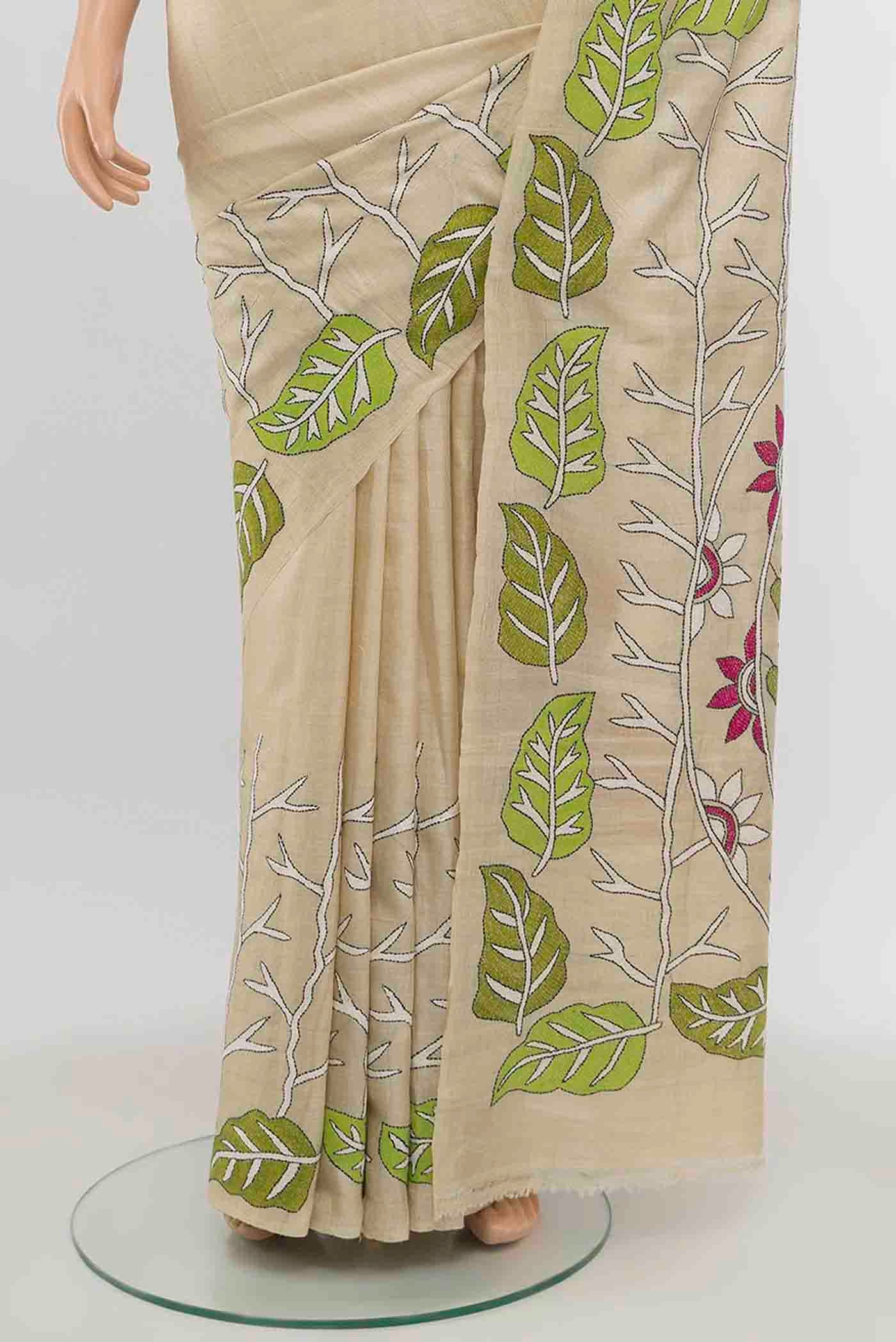 Pleats and pallu of Cream Tussar Silk Saree with Embroidery on the body and Silk Border