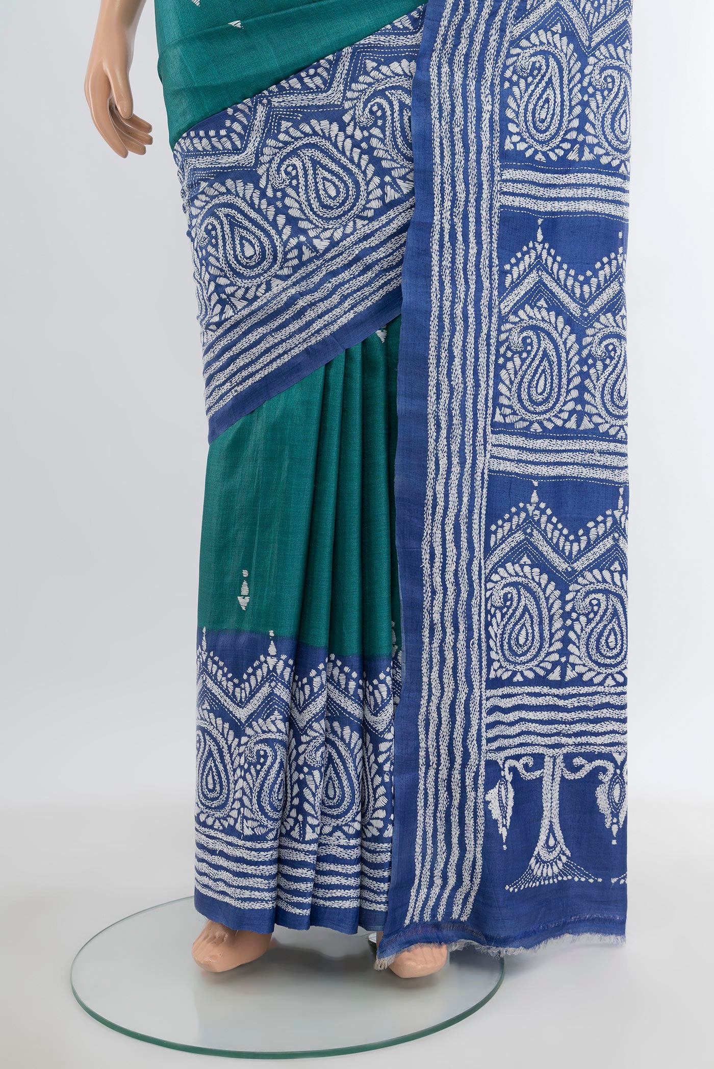 Pleats and pallu of Green Tussar Silk Saree with Kantha Work on the body and Embroidery Border. 